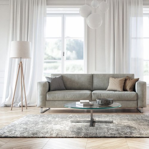 Living room with a grey sofa and carpet from Young's Interiors & Flooring in Ford City, PA