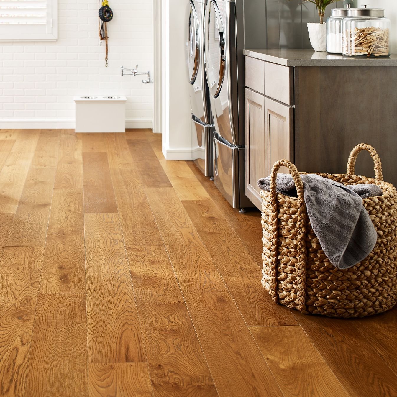 Basket laundry on a brown hardwood from Young's Interiors & Flooring in Ford City