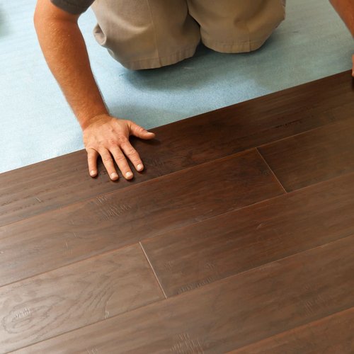 Installing hardwood from Young's Interiors & Flooring in Ford City